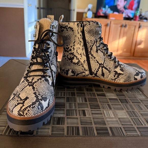 Shoes - NEW
Crown & Ivy Naomi Hiker Boots with a snakeskin print and faux fur trim.